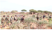 Somalian Army members patrol during an operation