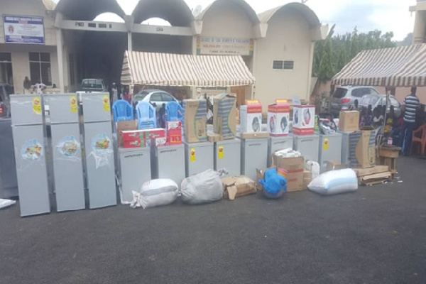 The items presented include deep freezers, corn mills, gas ovens, sewing machines and plastic chairs