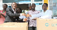 Official of Tobinco (left) donates the items to a rep of the hopsital