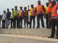 Sports Minister Isaac with staff of the construction company at the site