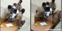 The dying student being helped by some of his colleagues