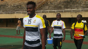 Defender Kassim Nuhu Adams in front