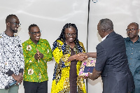 Alhassan Mahama Sani, presenting a citation to Prof. Rita Akosua Dickson