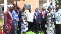 The minister with some officials in a group photograph