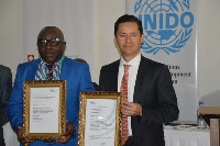 MD, QCC, Nana Karikari receiving the certificate from Juan Pablo of UNIDO