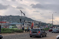 Some pedestrians trying to cross the street