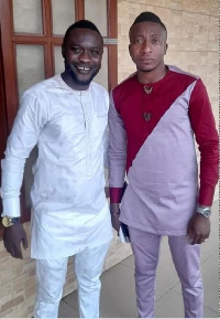 Patrick Akoto in a pose with Felix Annan at a wedding