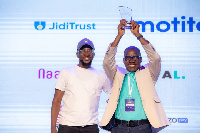 Festus William Amoyaw displays his award