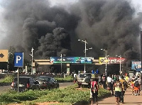 Plume of smoke hugs the sky after the road blockage and tyre burning