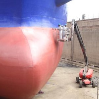 Workers of Tema Shipyard Limited working on a vessel in the drydock