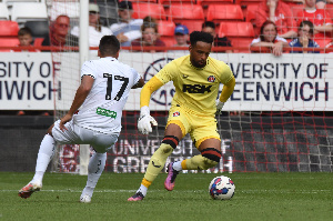 Wollacott (right) in action for his club