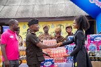 Edem Fairre presenting some items to the James camp prison