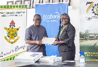 MD of of Ecobank Ghana, Dan Sackey presenting the laptops to the VC of KNUST, Rita Akosua Dickson