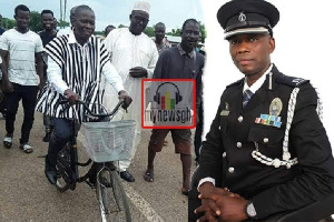 Superintendent Peter Lanchene Tuubo riding bicycle to file his nomination forms