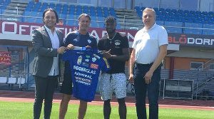 Paintsil (second right) with official of his new club during the unveiling