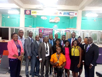 Staff of Opportunity International in a group photo with Botsyo Nkegbe