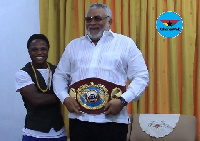 Isaac Dogboe with former President of Ghana, JJ Rawlings