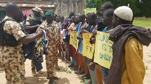 Nigerian army officials engaging Boko Haram fighters who surrendered in the past