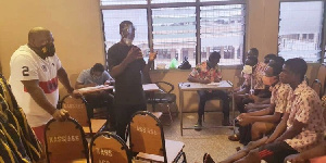 Nana Boakye and some NPP officials speaking to some SHS students