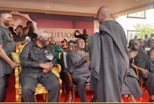 Ex-President John Agyekum Kufuor looks on as Appiah Stadium shakes hands with Dr Addo Kufour