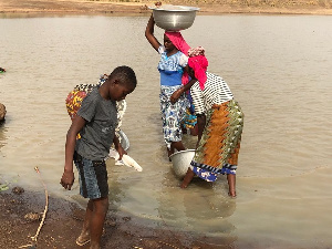 Some residents of Kusawgu fetching water from contaminated dam