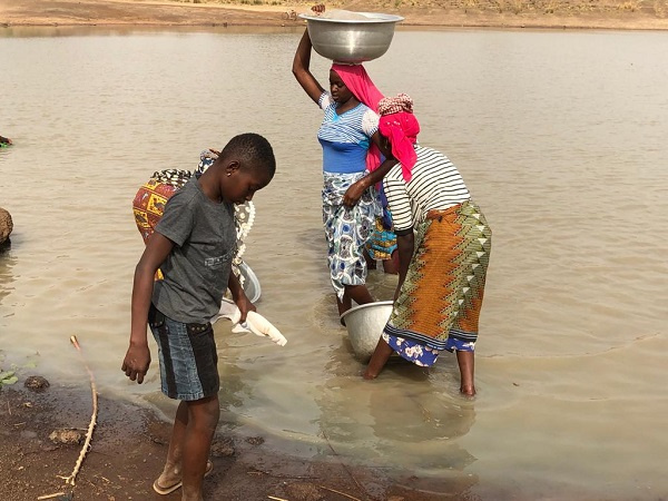 Some residents of Kusawgu fetching water from contaminated dam