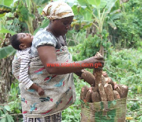 Eunice Ahenkorah on a farm with her daughter