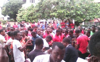 Scores of workers clad in red armband and red headgear were at the entrance of the hotel.