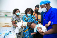 Chief of Staff, Frema Opare with the conjoined twins