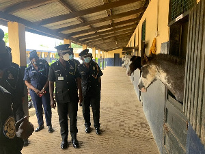 The acting IGP, Dr George Akuffo Dampare (middle) during his visit to the Mounted Squadron Unit