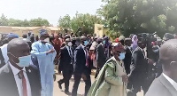 President Buhari acknowledging the crowd on his way to Eid prayers