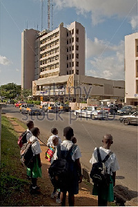 School children waiting to cross the road