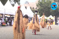 Masquerades dancing at Rawlings' mother's funeral