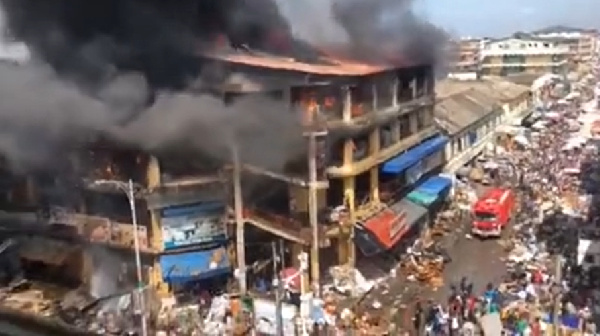 The fire ravaged a three-story building consuming goods and cash