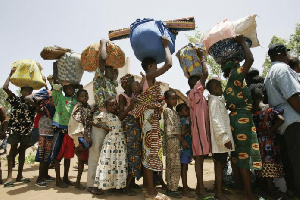 Nigerina Refugees In Queue Cameroon 696x464