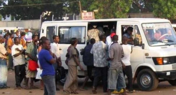 File photo of policemen passengers struggling for a car