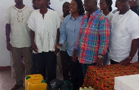 Samuel Atta Akyea presenting items to the SOS Village Director