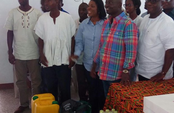 Samuel Atta Akyea presenting items to the SOS Village Director