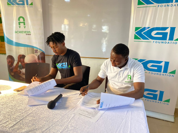 Mr Elliot Dadey (L) with Amadu Mohammed (R) of Achievers Ghana signing the partnership