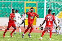 Etouga (middle) celebrates one of his three goals