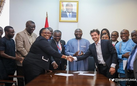 Deputy Minister of Health, Tina Mensah in a handshake with Keller Rinaudo, CEO of Zipline