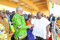 President Nana Addo Dankwa Akufo-Addo shakes hands with former President Rawlings.