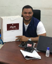 Nana Kwadwo Safo Jnr with a product from Obuobi Mpaboa