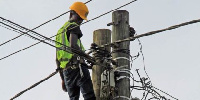 ECG official works on an electric pole | File photo