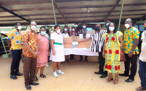 Madam Rita Botsoe receiving the items from Togbe Awalie III