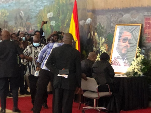 Former President, John Dramani Mahama and his wife Lordina Mahama signing the book of condolence