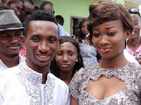 Black Stars defender Harrison Afful and wife