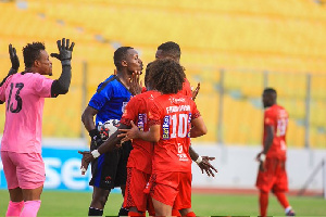 Asante Kotoko players protesting against referee's decision