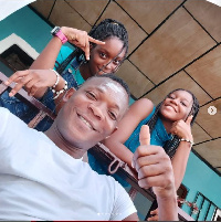 Former Black Stars defender, John Paintsil and daughters