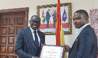 Godfred Yeboah Dame receiving the award